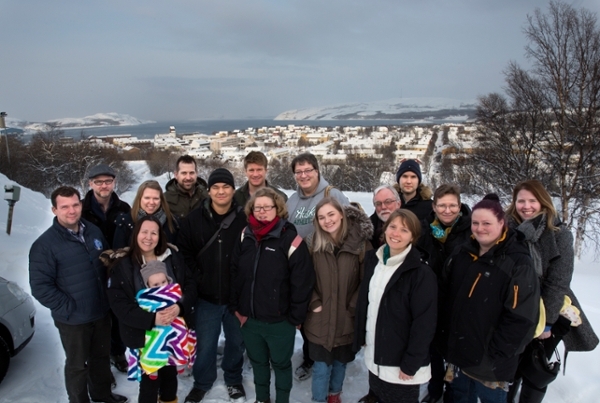 Group shot of GENI student, faculty and staff in front of the town of Kirkenes. Photo by: Stig Brøndbo/UiT The Arctic University of Norway